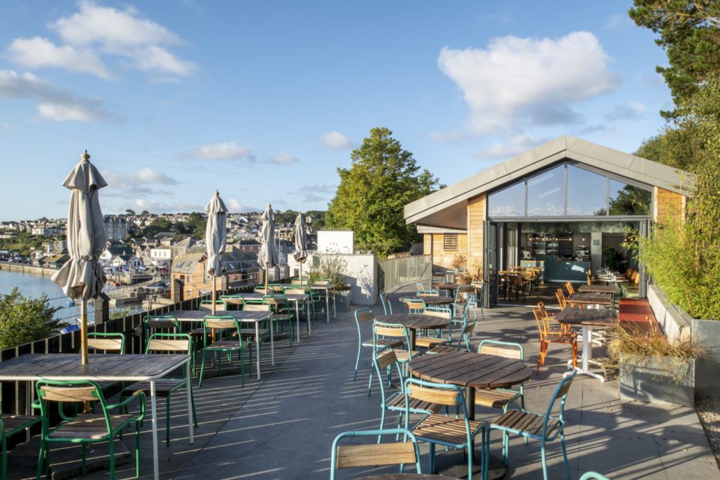 Large areas of glazing fill the interior with natural light and open onto the terrace with panoramic views of the Camel Estuary